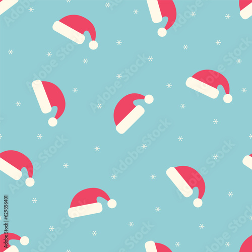 Seamless pattern with Santa Claus hats and snowflakes on a blue background. winter vector illustration.