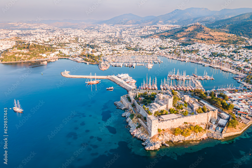 Bodrum ancient castle with Bodrum marina at sunrise, aerial view
