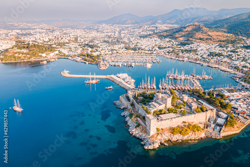 Bodrum ancient castle with Bodrum marina at sunrise, aerial view photo