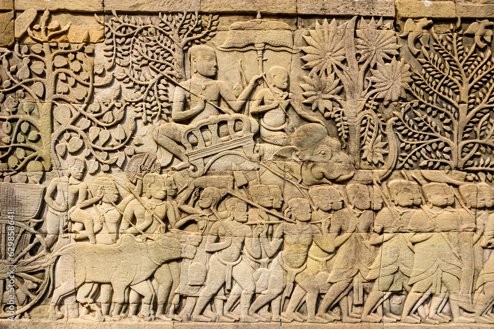Naklejka premium Picturial stories carved into the wall at the Unesco World Heritage site of Ankor Thom, Siem Reap, Cambodia