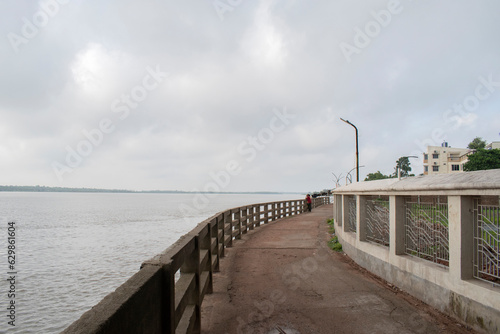 driveway and walkway to the riverside hotels and resorts along the ichamati riverside at taki, west bengal, india photo