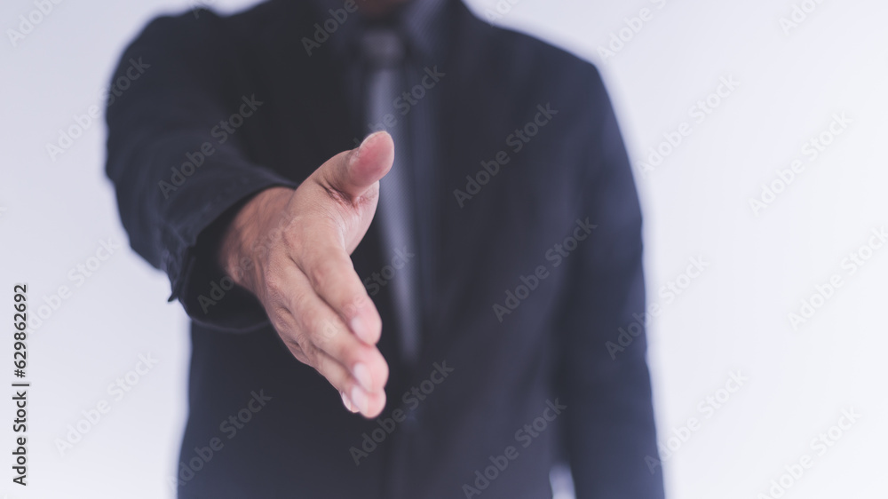 the businessman acting shake hand on white background