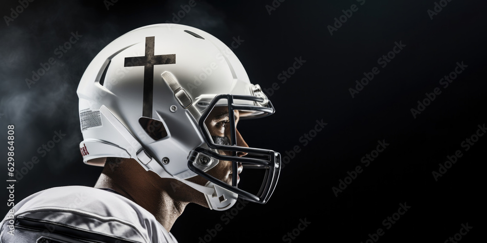 Team Jesus. Close-up of an american football player wearing a helmet with a cross Team Jesus. Close-up of an american football player wearing a helmet with a cross