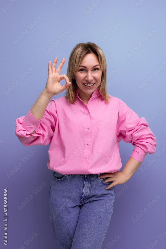 young positive cheerful blond european leader woman with shoulder-length hair in a pink blouse young positive cheerful blond european leader woman with shoulder-length hair in a pink blouse