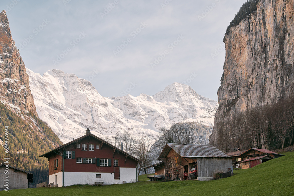 Swiss Alpine Paradise. Grindelwald Village and Majestic Mountain Panorama in Bernese Oberland, Switzerland. Alps background landscape panorama Swiss Alpine Paradise. Grindelwald Village and Majestic Mountain Panorama in Bernese Oberland, Switzerland. Alps background landscape panorama