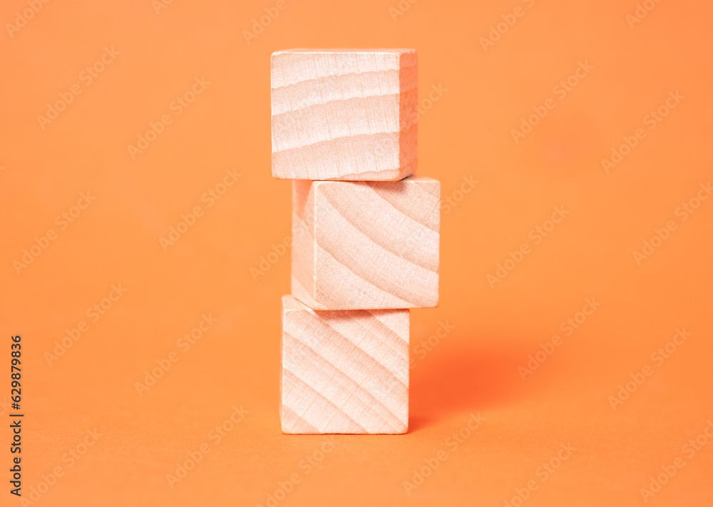 Three empty wooden cubes with place for letters Three empty wooden cubes with place for letters