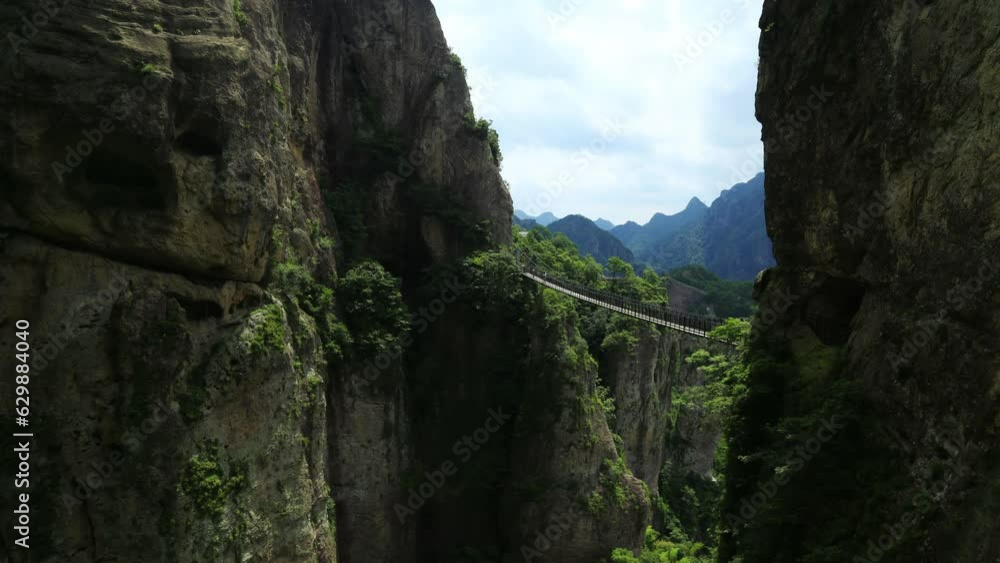 Cable bridge in Yandang Mountain time lapse.Yandang Mountain was named a world Geopark.Known at home and abroad for its unique peaks, rocks, waterfalls and ancient caves. Cable bridge in Yandang Mountain time lapse.Yandang Mountain was named a world Geopark.Known at home and abroad for its unique peaks, rocks, waterfalls and ancient caves.