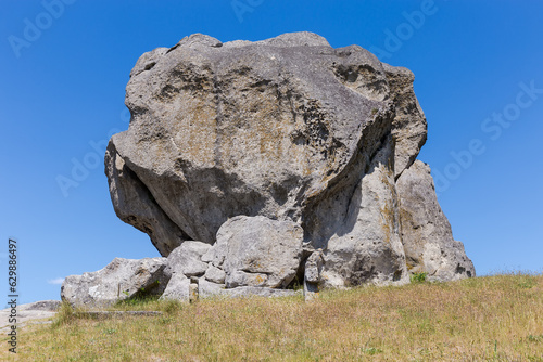 Single sandstone rock on hill top in Pidkamin village, Ukraine photo