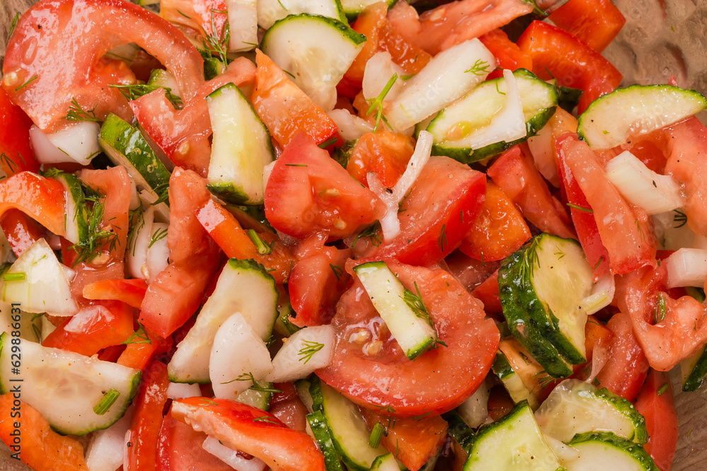 Salad of tomatoes, cucumbers and red bell peppers, top view Salad of tomatoes, cucumbers and red bell peppers, top view