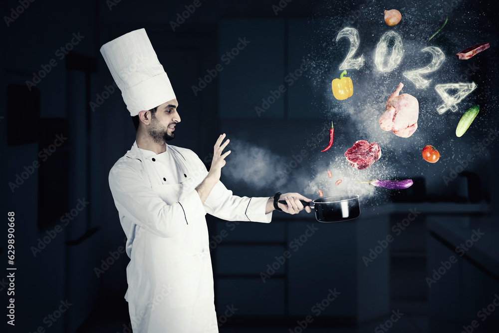 Chef with 2024 numbers in the kitchen Stock Photo | Adobe Stock