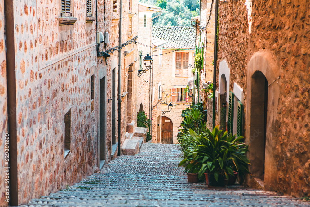 View of a medieval street in the Old Town of the picturesque Spanish-style village Fornalutx, Majorca or Mallorca island