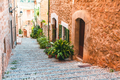 Fototapeta Naklejka Na Ścianę i Meble -  View of a medieval street in the Old Town of the picturesque Spanish-style village Fornalutx, Majorca or Mallorca island