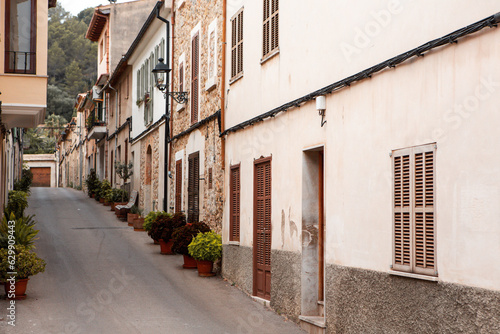 View of a medieval street of the picturesque Spanish-style village Mancor de la Vall in Majorca or Mallorca island, Spain. © romeof