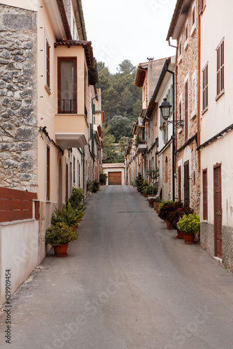 View of a medieval street of the picturesque Spanish-style village Mancor de la Vall in Majorca or Mallorca island, Spain.