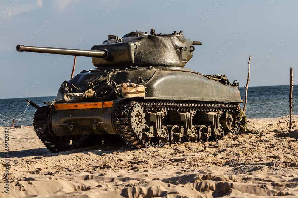 Fototapeta premium An American World War II Sherman tank on the beach.