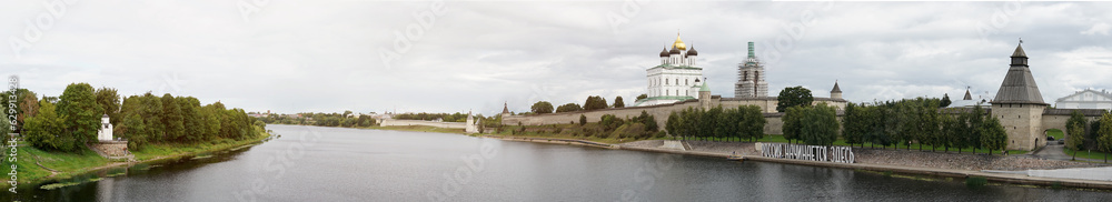 Panorama. View of the Pskov Kremlin from the bridge to the river.