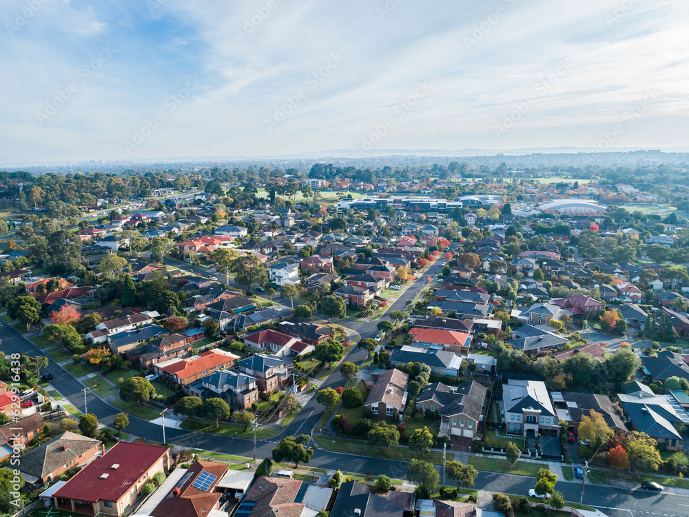 Aerial view of morning light over autumn tree dotted streets of Australian city suburb Aerial view of morning light over autumn tree dotted streets of Australian city suburb