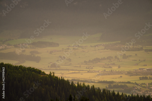 beautiful panoramic view of a valley at a foggy and sunny summer morning