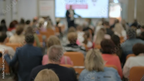 Wallpaper Mural Speech of male employee at business conference. Speaker talks to audience at scene in crowded hall. Adult man explains motivation to group of people. 4K Torontodigital.ca