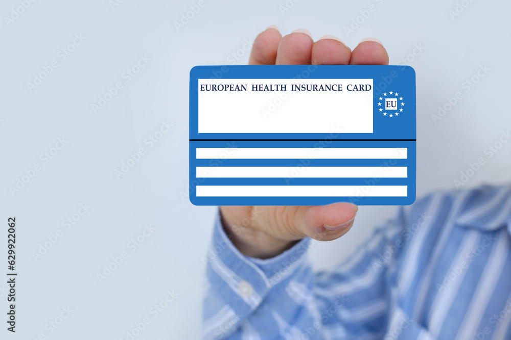 European health insurance card in female hand, blue EU document healthcare support, medical expenses, emergency, international Travel insurance EU and EFTA traveling, healthcare information European health insurance card in female hand, blue EU document healthcare support, medical expenses, emergency, international Travel insurance EU and EFTA traveling, healthcare information