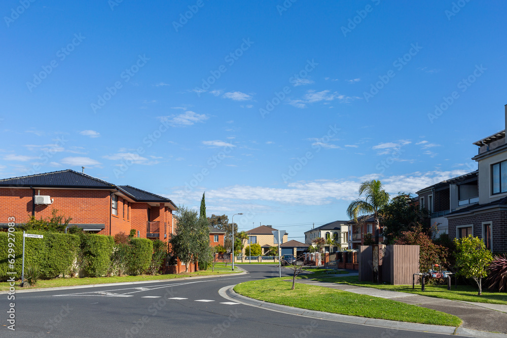 Road through brick buildings in housing area in outer city suburb of Springvale, Melbourne, Victoria Road through brick buildings in housing area in outer city suburb of Springvale, Melbourne, Victoria