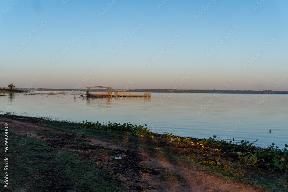 Sunset on the river with birds and plants