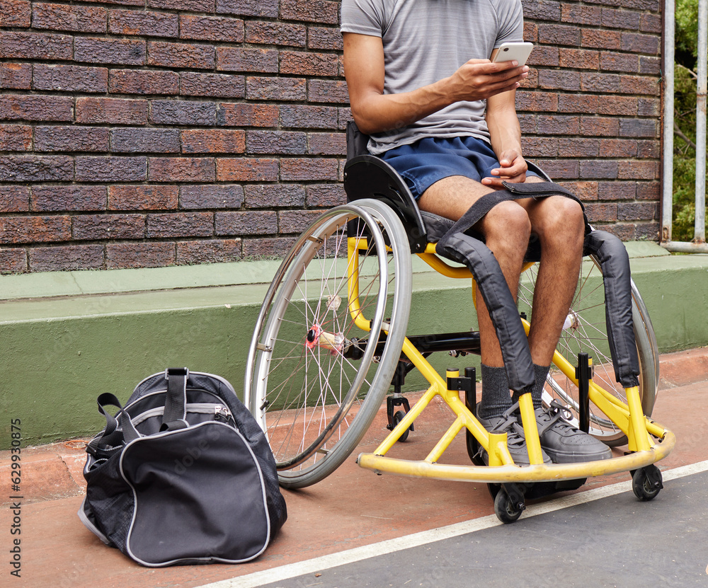 Obraz premium Sports, wheelchair basketball and a man with a disability on a court for fitness, training or competition. Phone, legs and exercise with a male athlete outdoor for a workout as a game player