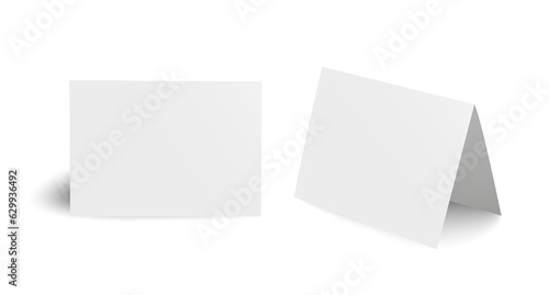 Realistic blank bent paper cards isolated on transparent background
