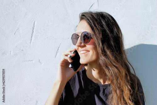 woman on the phone with a white background