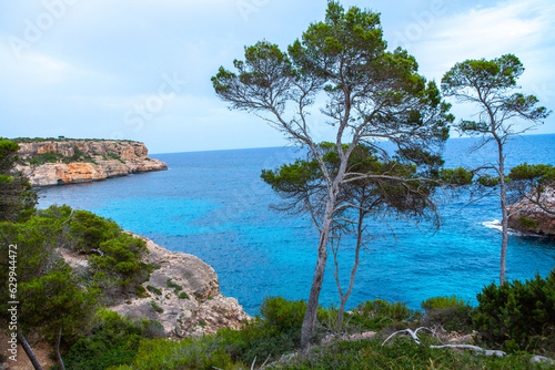 Beautiful sunset beach landscape, exotic tropical island nature, blue sea water, ocean waves, summer holidays vacation in Mallorca, Spain