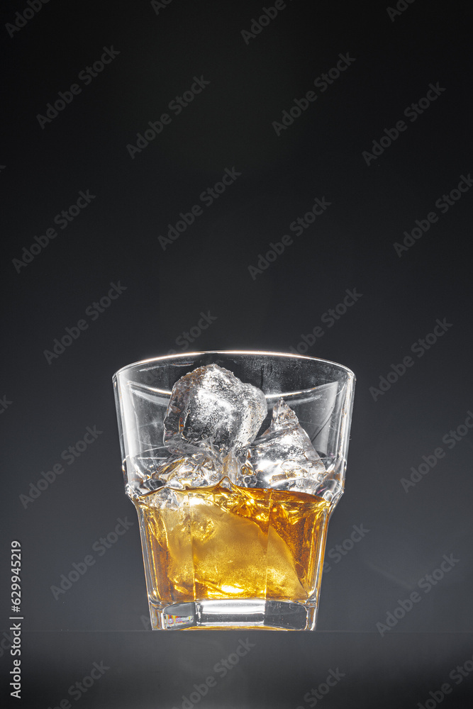 Glass of whisky on black background, copy space Glass of whisky on black background, copy space
