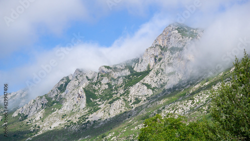 Mountain landscape with the clouds touching the peaks of the mountains
