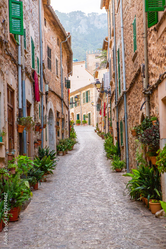 View of a medieval street of the picturesque Spanish-style village Valdemossa in Majorca or Mallorca island, Spain. © romeof