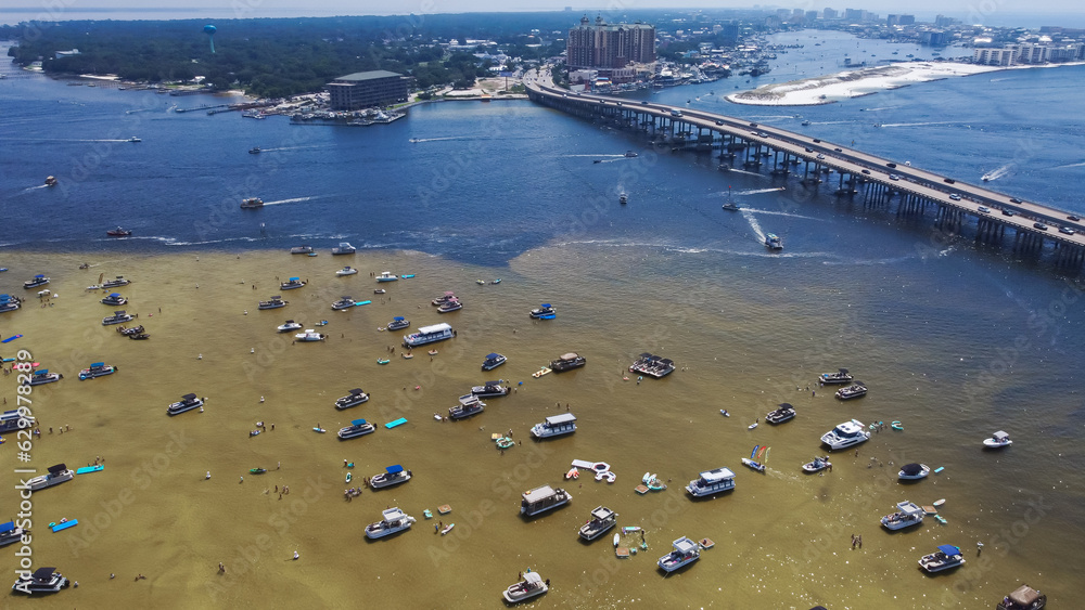 Busy day on Crab Island, Destin Florida with dense of tourist boats