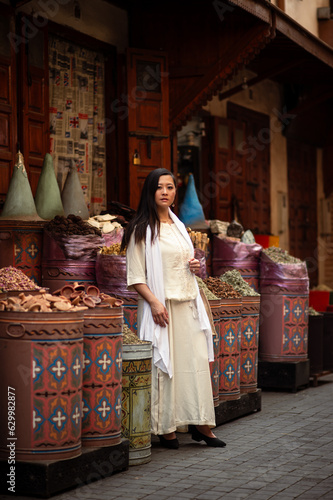 Asian woman exploring the spice markets of north Africa.