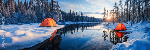 winter camping scene with a cozy tent set up amidst a snowy forest. The icy landscape reflects the cold temperatures of the season, while the nearby frozen lake adds to the serene beauty of nature.