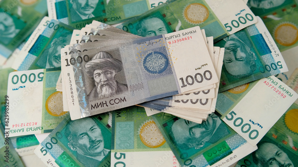 a-stack-of-1000-kyrgyz-som-is-on-5000-banknotes-kyrgyz-national