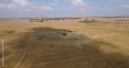 Aerial view of ancient megalithic monument site in the shape of 3 concentric stone circles, Rujum Al-Hiri, Golan Heights, Israel. photo