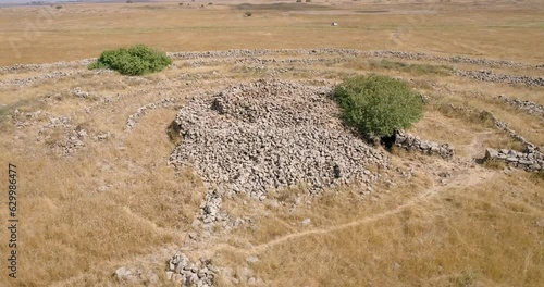 Aerial view of ancient megalithic monument site in the shape of 3 concentric stone circles, Rujum Al-Hiri, Golan Heights, Israel. photo