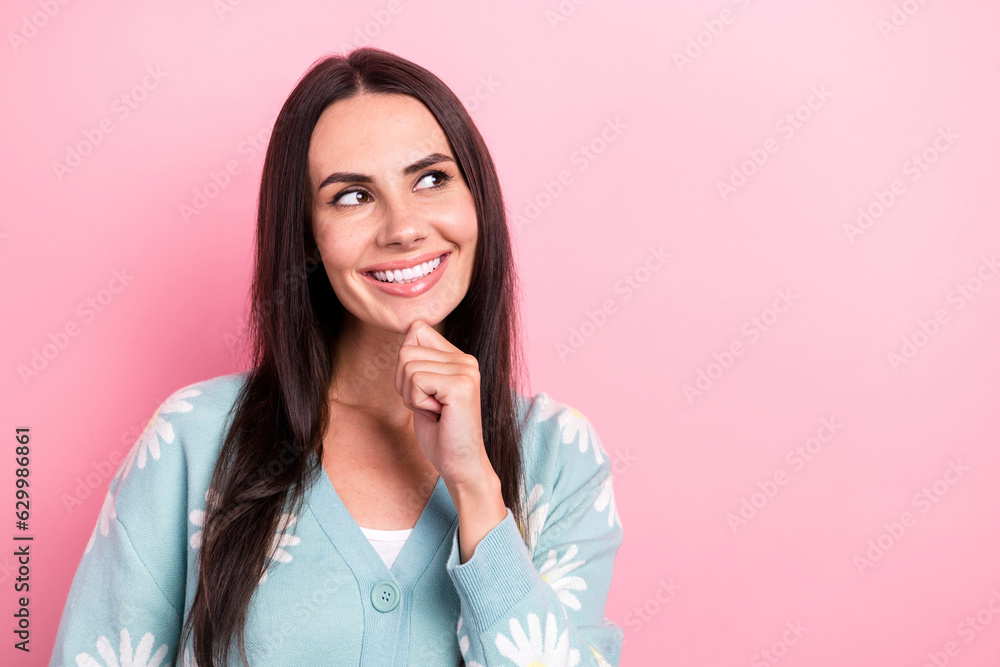 Portrait of pretty girl with long hairstyle wear flower print pullover look empty space proposition isolated on pink color background Portrait of pretty girl with long hairstyle wear flower print pullover look empty space proposition isolated on pink color background