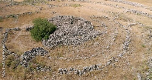 Aerial view of ancient megalithic monument site in the shape of 3 concentric stone circles, Rujum Al-Hiri, Golan Heights, Israel. photo