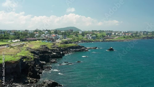 A view of the blue and clear coast of Jeju Island and the horizon.