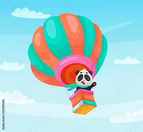 Cute panda pilot is flying on airballoon through the clouds. Vector cartoon illustration for children photo