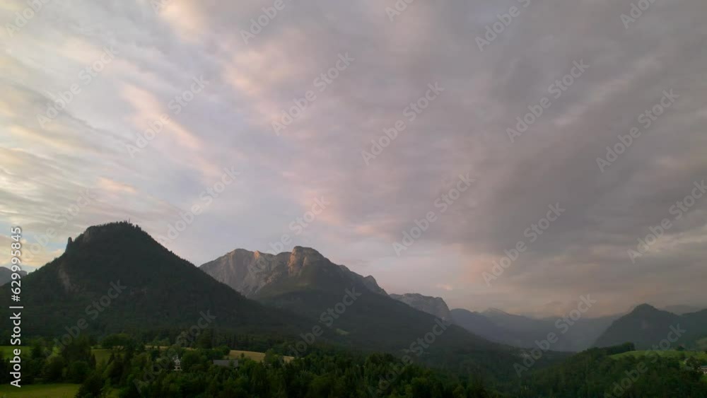 Stunning Austrian mountains from a bird's-eye view. Fascinating blue lake, green mountain forests. Mountain towns. Roads for travel. Stunning Austrian mountains from a bird's-eye view. Fascinating blue lake, green mountain forests. Mountain towns. Roads for travel.