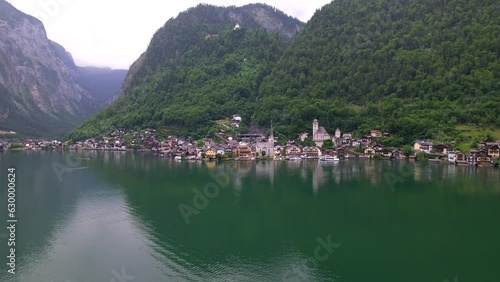 Stunning Austrian mountains from a bird's-eye view. Fascinating blue lake, green mountain forests. Mountain towns. Roads for travel.