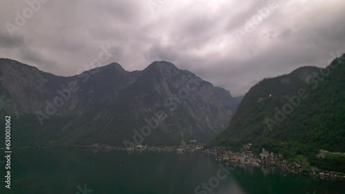 Stunning Austrian mountains from a bird's-eye view. Fascinating blue lake, green mountain forests. Mountain towns. Roads for travel.