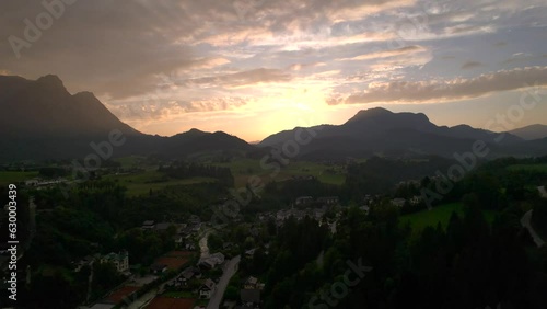Stunning Austrian mountains from a bird's-eye view. Fascinating blue lake, green mountain forests. Mountain towns. Roads for travel.