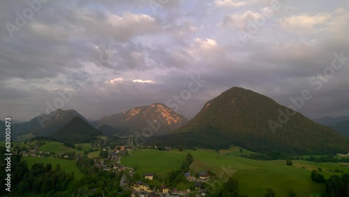 Stunning Austrian mountains from a bird's-eye view. Fascinating blue lake, green mountain forests. Mountain towns. Roads for travel.