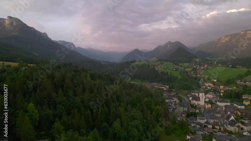 Stunning Austrian mountains from a bird's-eye view. Fascinating blue lake, green mountain forests.