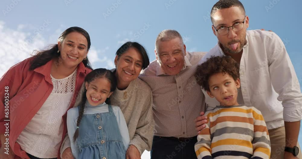 Family, silly face and tongue out for fun with bonding on vacation with blue sky and smile. Grandparents, kids and parents on holiday outdoor in nature with senior people and comic children with care Family, silly face and tongue out for fun with bonding on vacation with blue sky and smile. Grandparents, kids and parents on holiday outdoor in nature with senior people and comic children with care